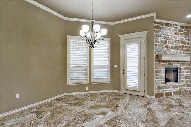 unfurnished dining area with crown molding, a fireplace, and an inviting chandelier