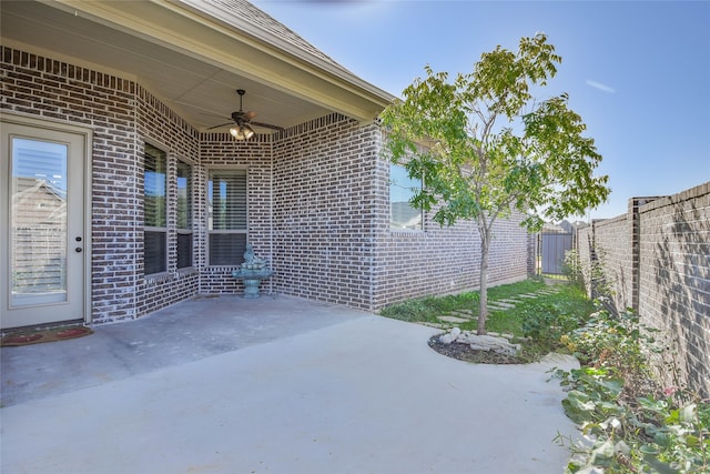 view of patio featuring ceiling fan