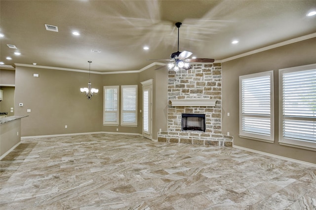 unfurnished living room featuring a fireplace, ceiling fan with notable chandelier, and crown molding