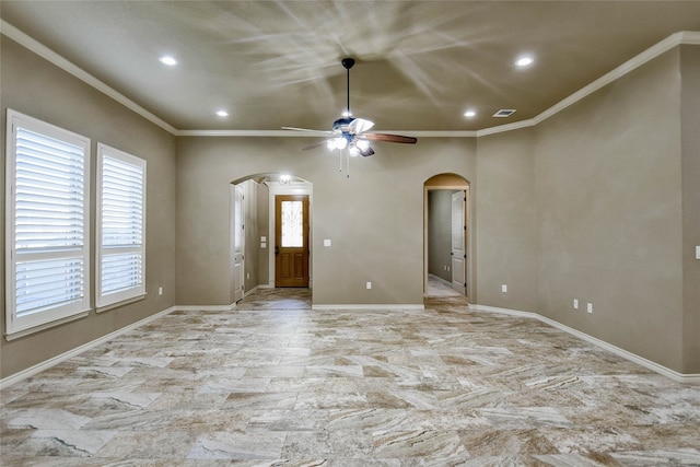 interior space featuring ceiling fan and crown molding