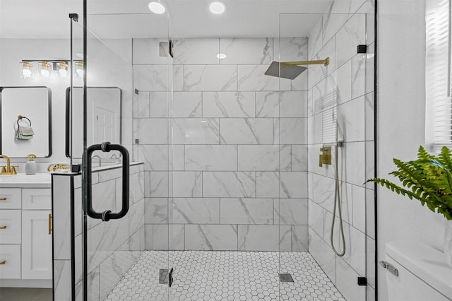 bathroom with vanity, an enclosed shower, and toilet