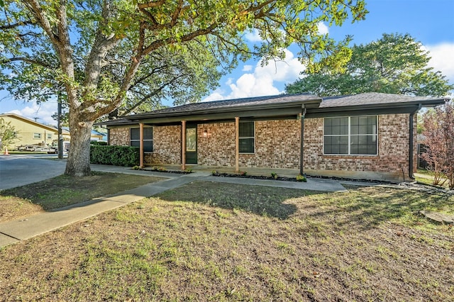 ranch-style house with a front lawn