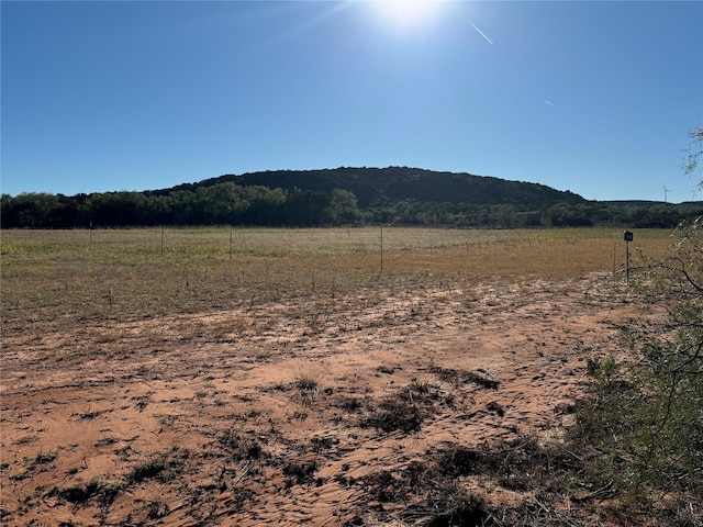 property view of mountains featuring a rural view