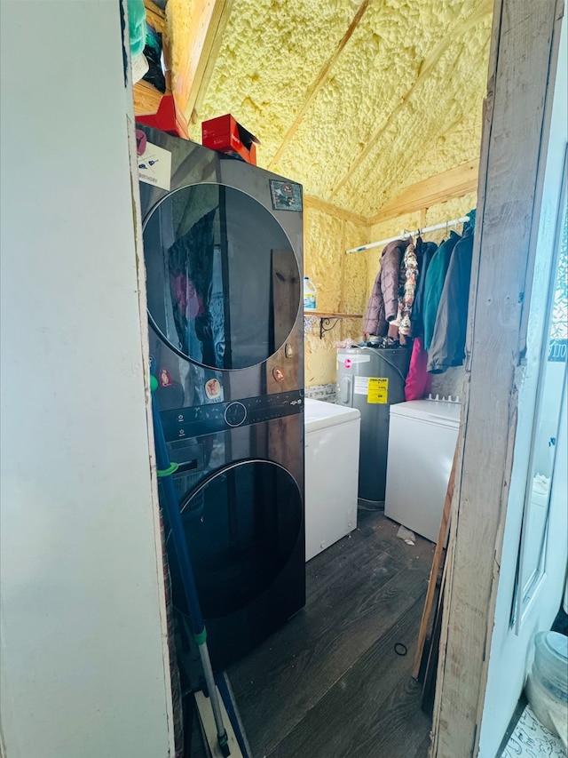 washroom with laundry area, stacked washer and dryer, dark wood-type flooring, and electric water heater