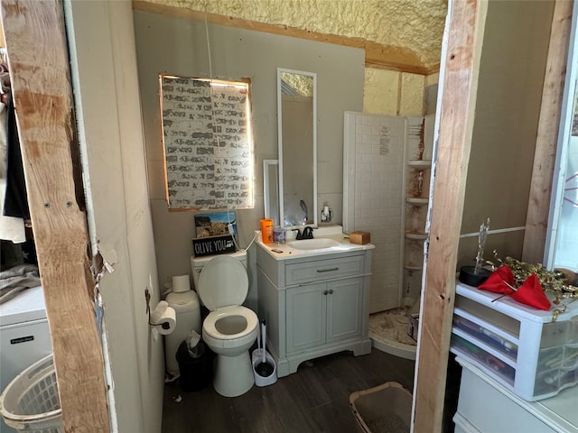 bathroom featuring vanity, wood-type flooring, and toilet