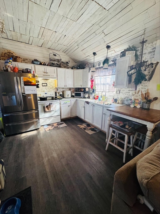 kitchen with white appliances, white cabinetry, light countertops, dark wood-style floors, and decorative light fixtures