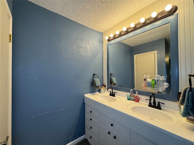 bathroom featuring vanity and a textured ceiling