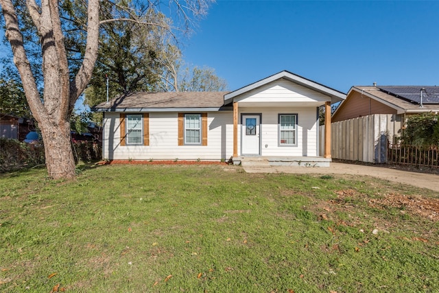 view of front of home featuring a front yard and a porch