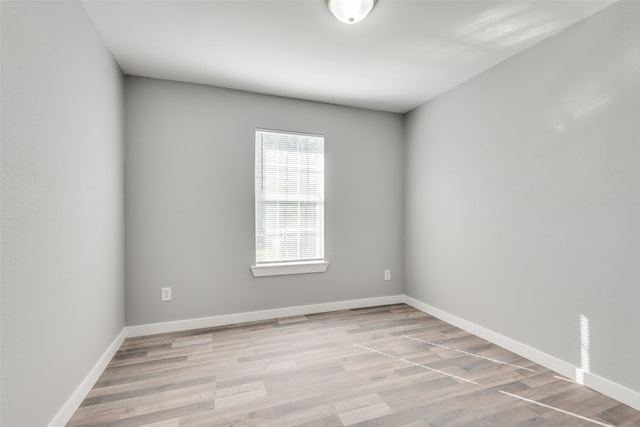 spare room with light wood-type flooring