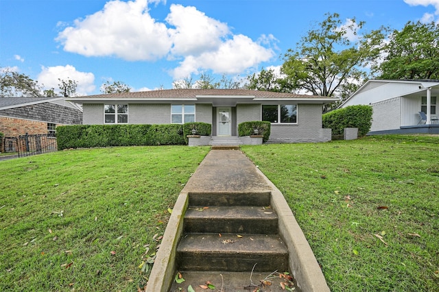 ranch-style house with a front lawn