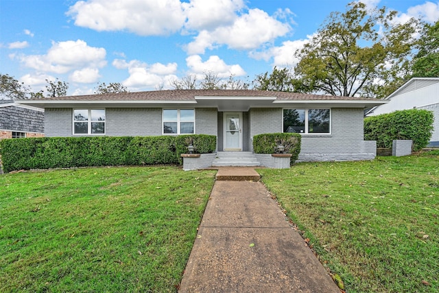 ranch-style house with a front lawn