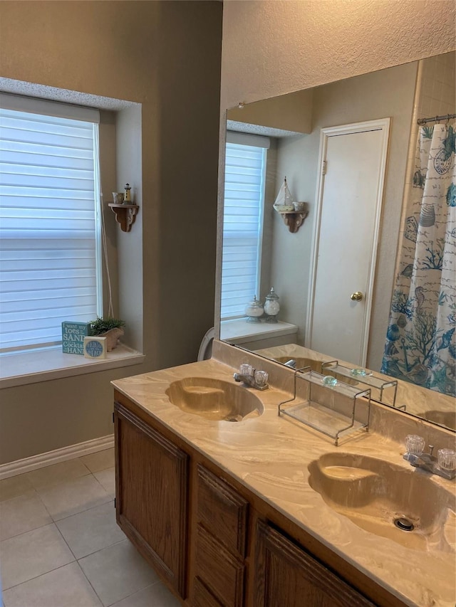 710 Cresent Dr, Desoto, TX 75115 - bathroom featuring double vanity and tile patterned floors