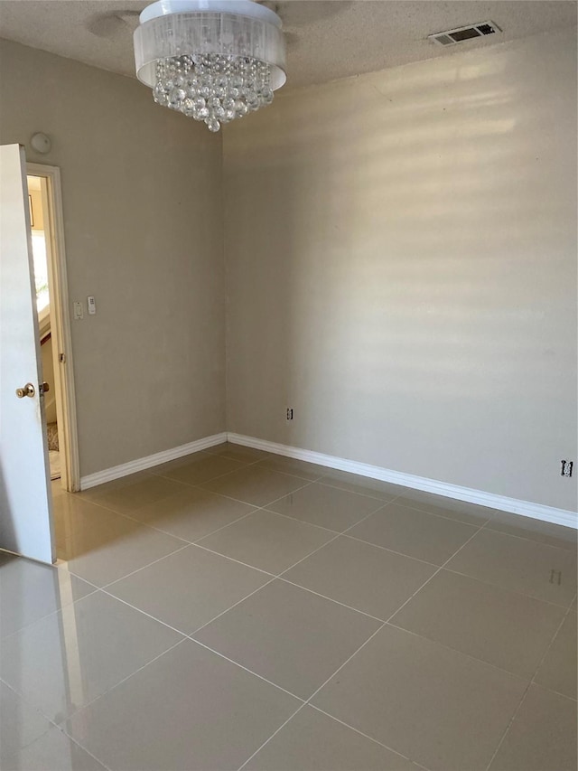 710 Cresent Dr, Desoto, TX 75115 - tiled empty room with baseboards and a chandelier