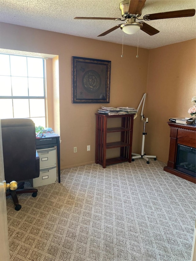710 Cresent Dr, Desoto, TX 75115 - carpeted home office with a ceiling fan and a textured ceiling