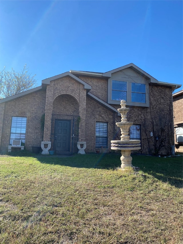 view of front facade featuring a front yard