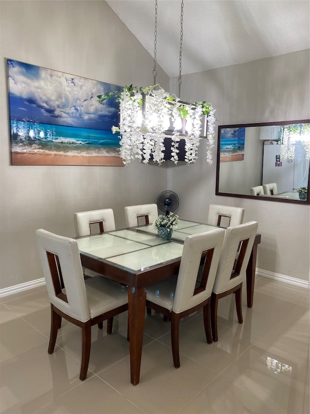 710 Cresent Dr, Desoto, TX 75115 - dining space featuring a chandelier, tile patterned floors, and vaulted ceiling