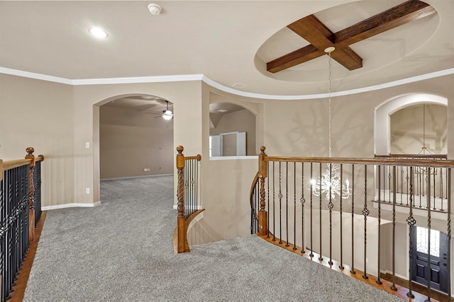 hallway featuring carpet, ornamental molding, and coffered ceiling