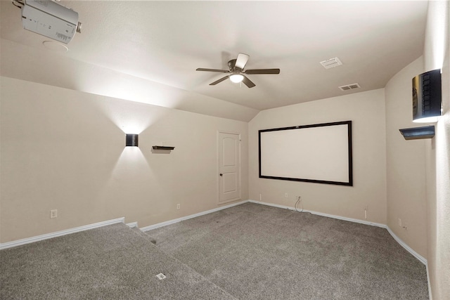 home theater room featuring carpet, ceiling fan, and lofted ceiling