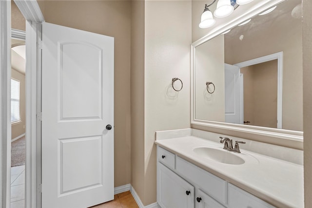 bathroom with tile patterned flooring and vanity