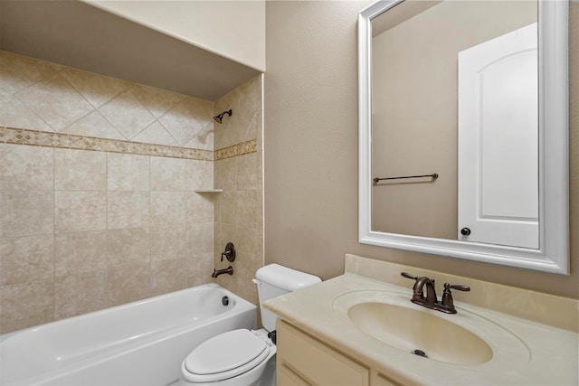 full bathroom with toilet, vanity, and tiled shower / bath