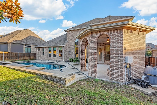 view of pool featuring a patio area and a yard