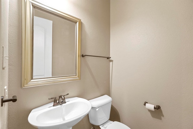 bathroom with sink and toilet