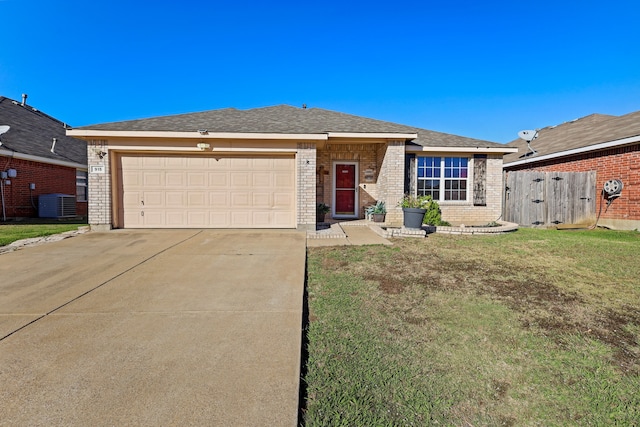 ranch-style house featuring central AC, a garage, and a front lawn