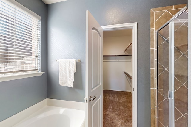 bathroom featuring plus walk in shower