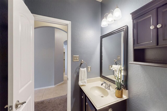 bathroom featuring tile patterned flooring and vanity