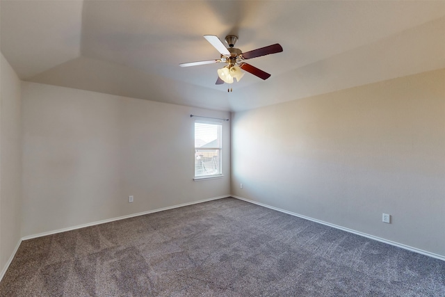 spare room with ceiling fan and carpet