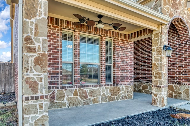 view of exterior entry featuring ceiling fan