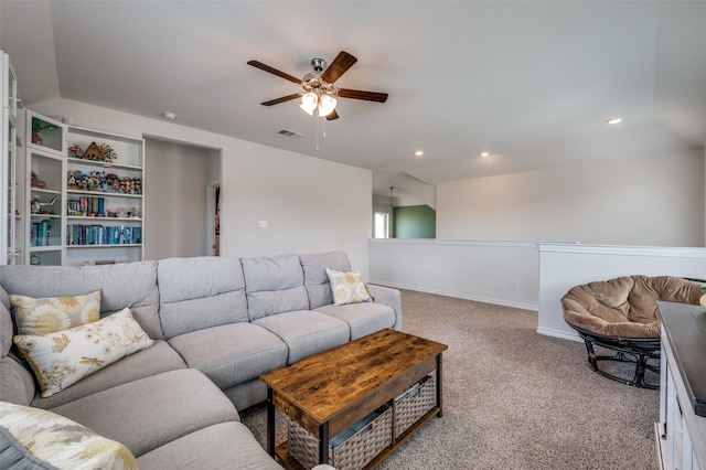 carpeted living room featuring ceiling fan