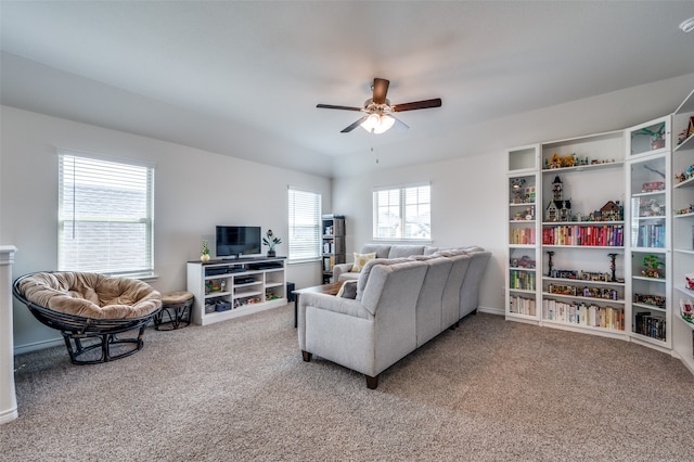 living room with ceiling fan and carpet flooring