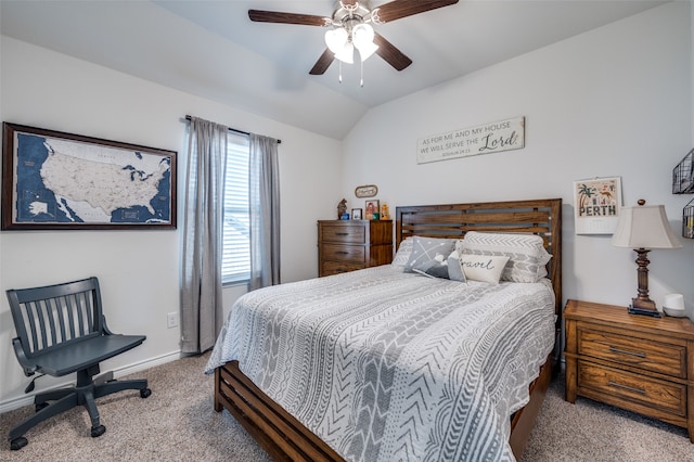 carpeted bedroom with vaulted ceiling and ceiling fan