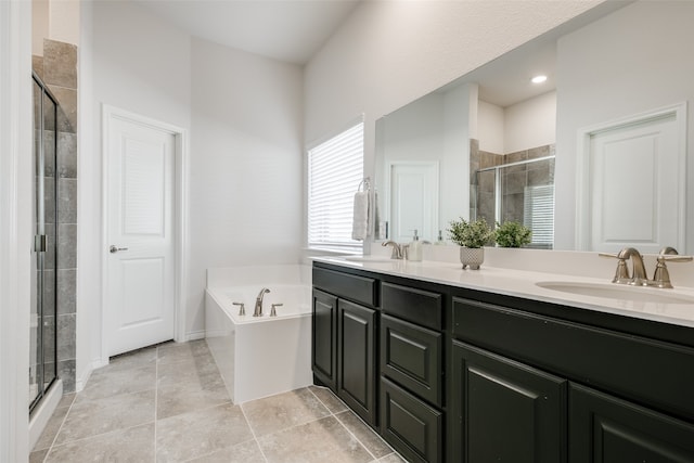 bathroom featuring shower with separate bathtub and vanity