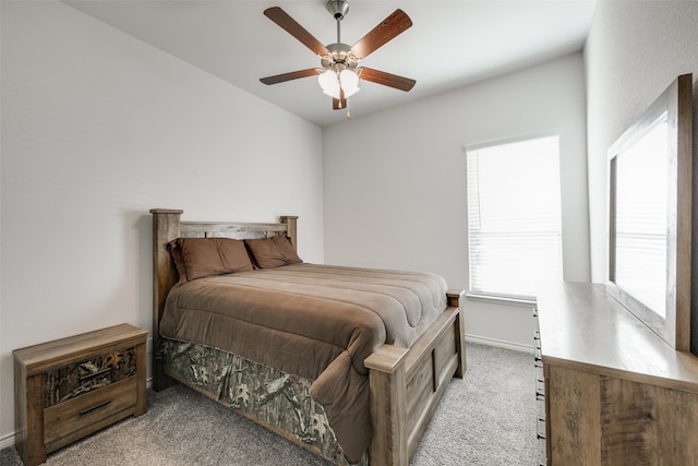 bedroom with light carpet and ceiling fan