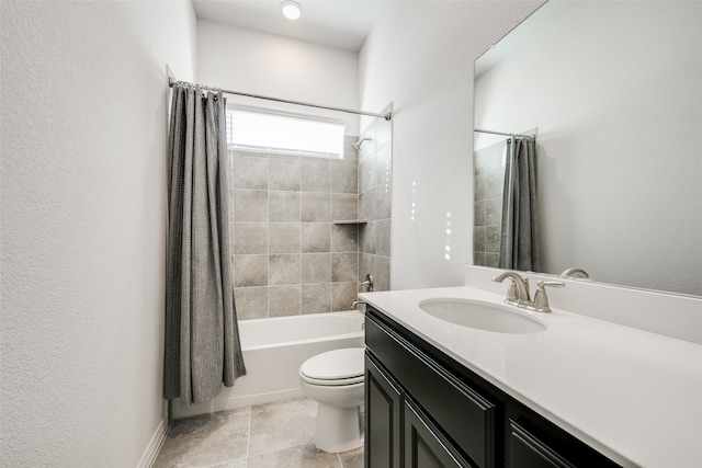 full bathroom with vanity, shower / tub combo, and toilet