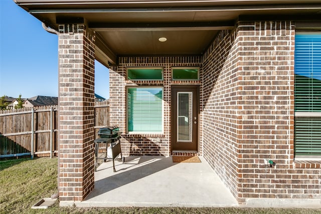 doorway to property featuring a patio area