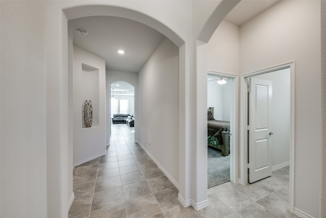 hallway with light tile patterned floors