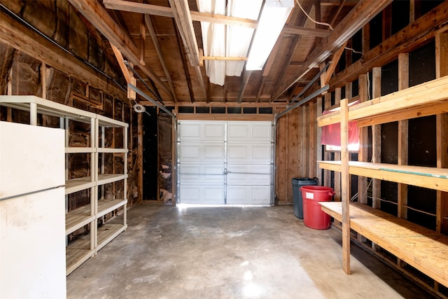 garage featuring white fridge