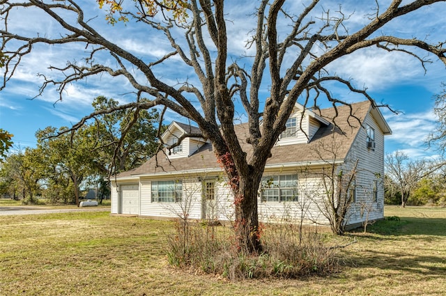 view of side of property featuring a yard