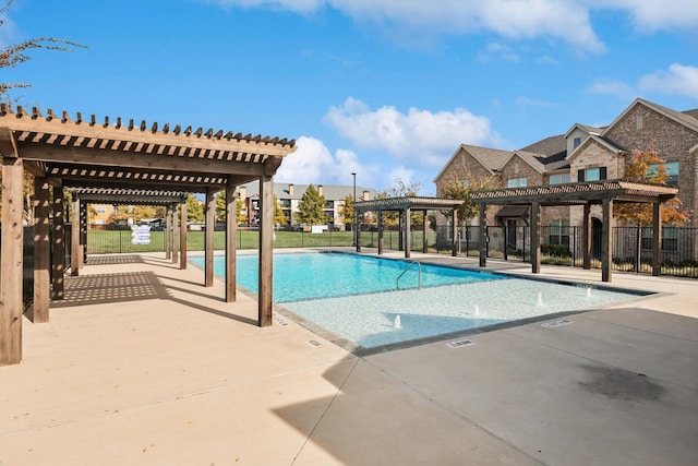 view of swimming pool featuring a pergola and a patio