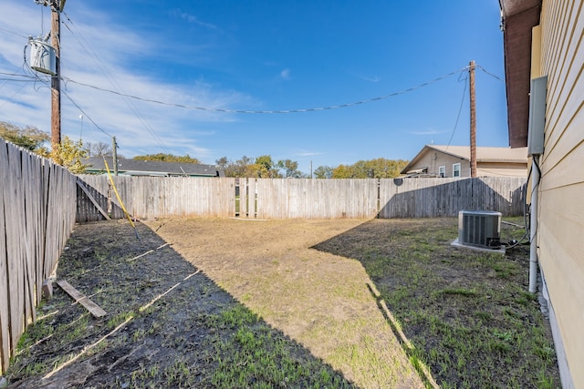 view of yard with central air condition unit