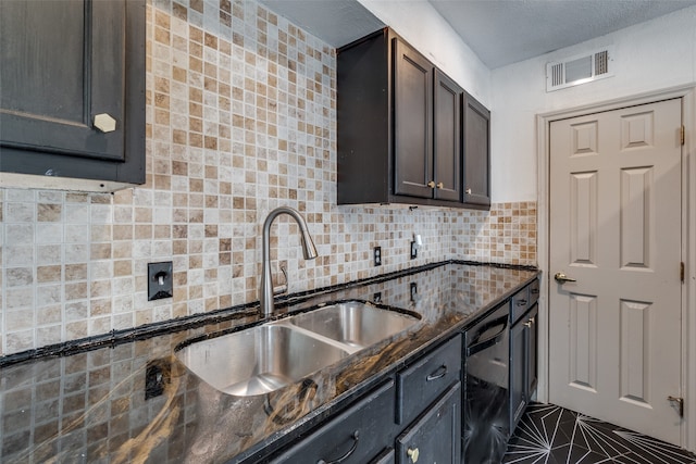 kitchen featuring backsplash, dark stone counters, dark brown cabinetry, sink, and dishwasher