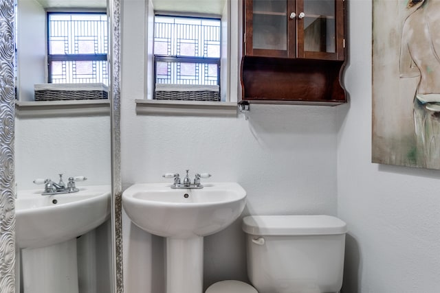 bathroom featuring toilet and sink