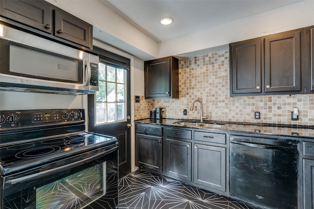 kitchen featuring dark brown cabinetry, sink, dark tile patterned floors, backsplash, and black appliances