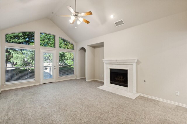 spare room featuring lofted ceiling, crown molding, light carpet, and ceiling fan