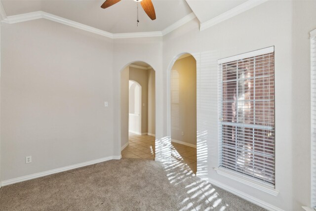 kitchen featuring sink, ceiling fan, stainless steel appliances, a kitchen island, and decorative backsplash