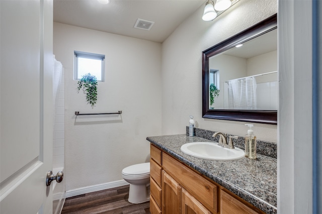 bathroom with hardwood / wood-style flooring, vanity, toilet, and a shower with curtain