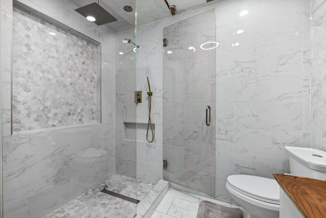 bathroom featuring a shower with shower door, tile walls, and toilet